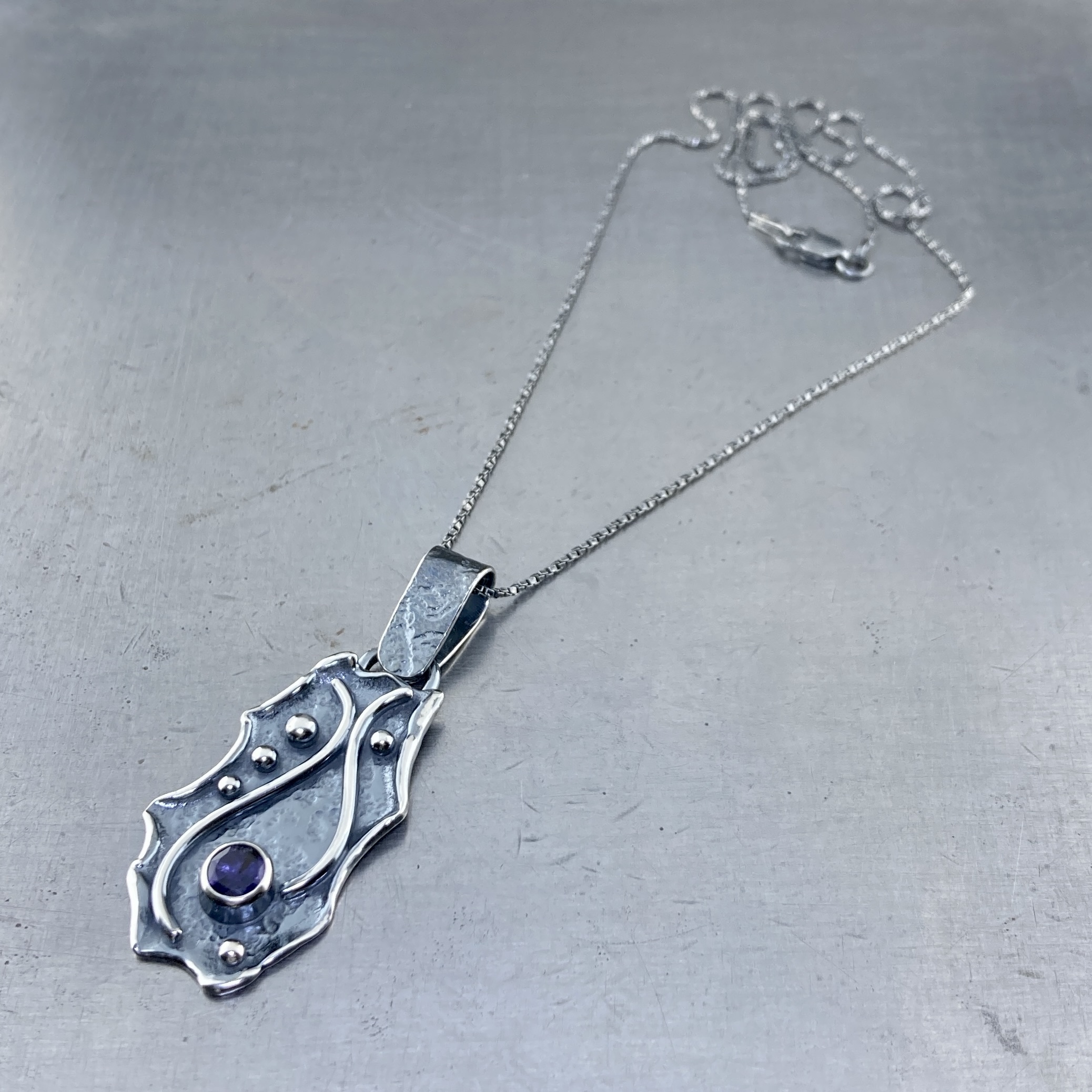 iolite pendant - Argentium silver waves - .75 carat