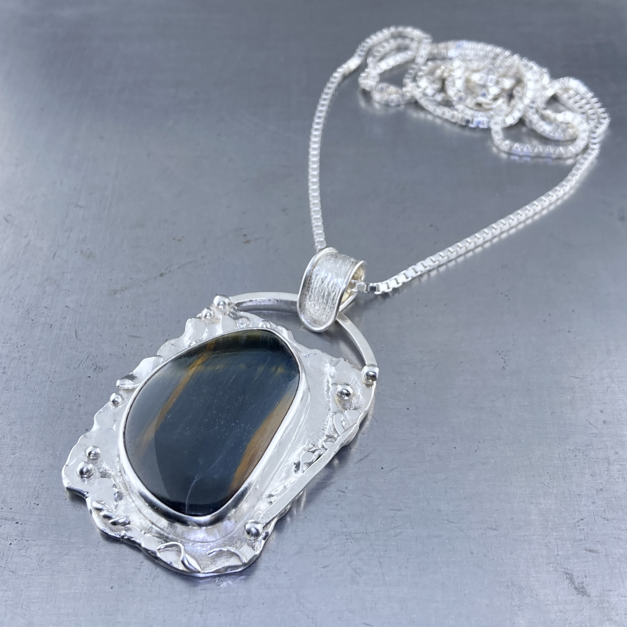 hawk's eye pendant - Argentium silver rapids